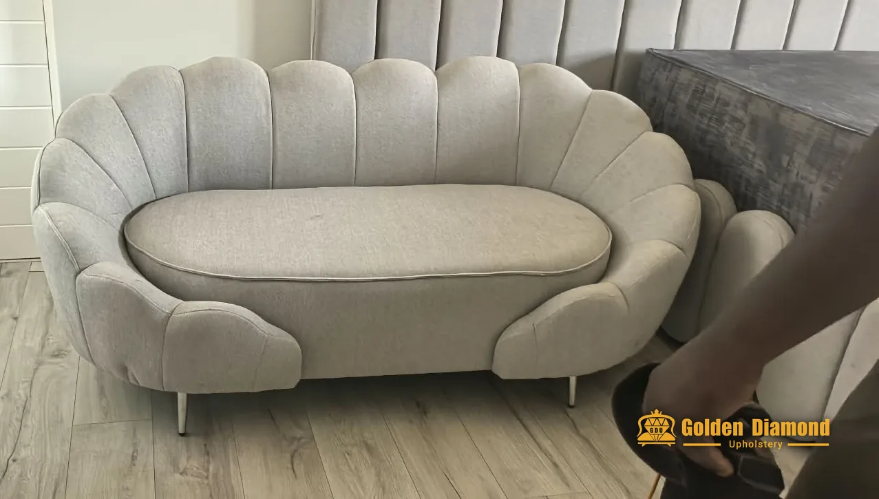 Cream scalloped curved sofa upholstered by Golden Diamond Upholstery, Cape Town
